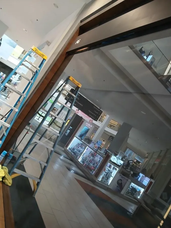Client-supplied commercial interior with ladders and glass partitions
