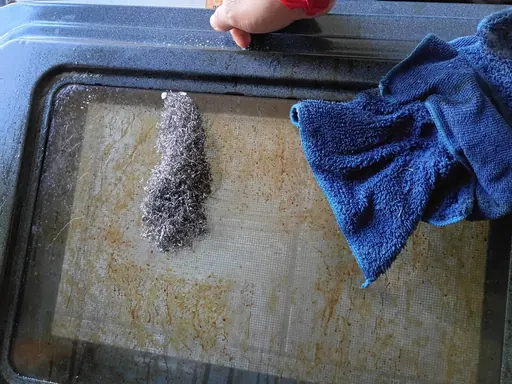 Appliance filter being cleaned