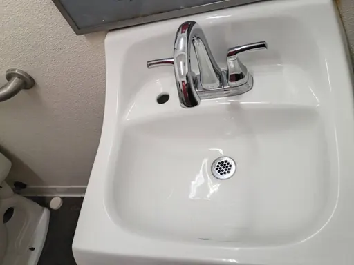 Bathroom sink and chrome faucet