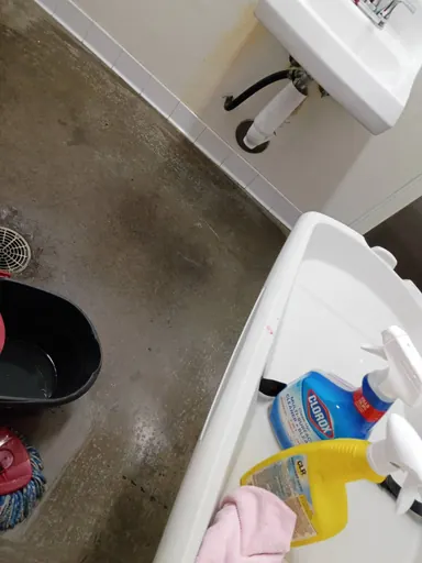 Bathroom floor and cleaning supplies