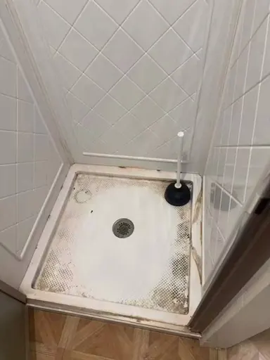 Shower floor before cleaning