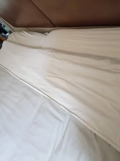 Bed with arranged white bedding